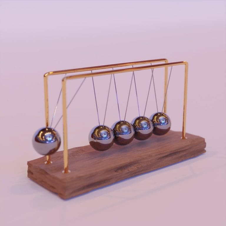 a wooden stand with three metal balls on it